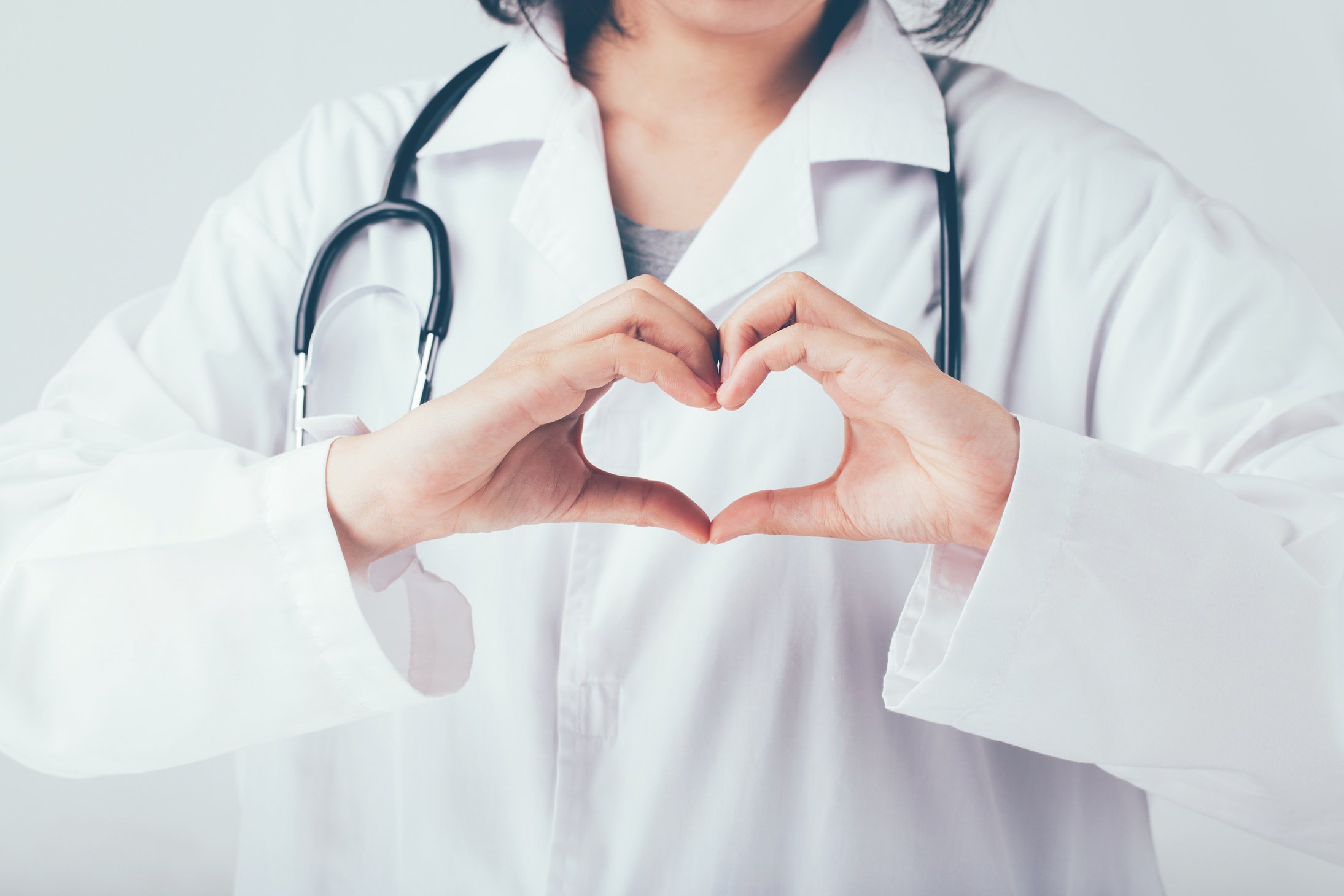 Doctor Making Heart Shape Hand Gesture